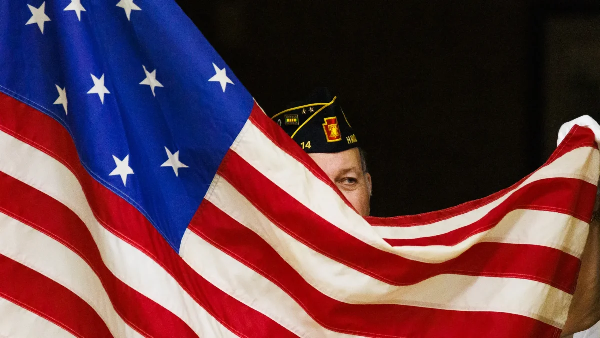 US flag and US service man
Photo by Harrison Jones